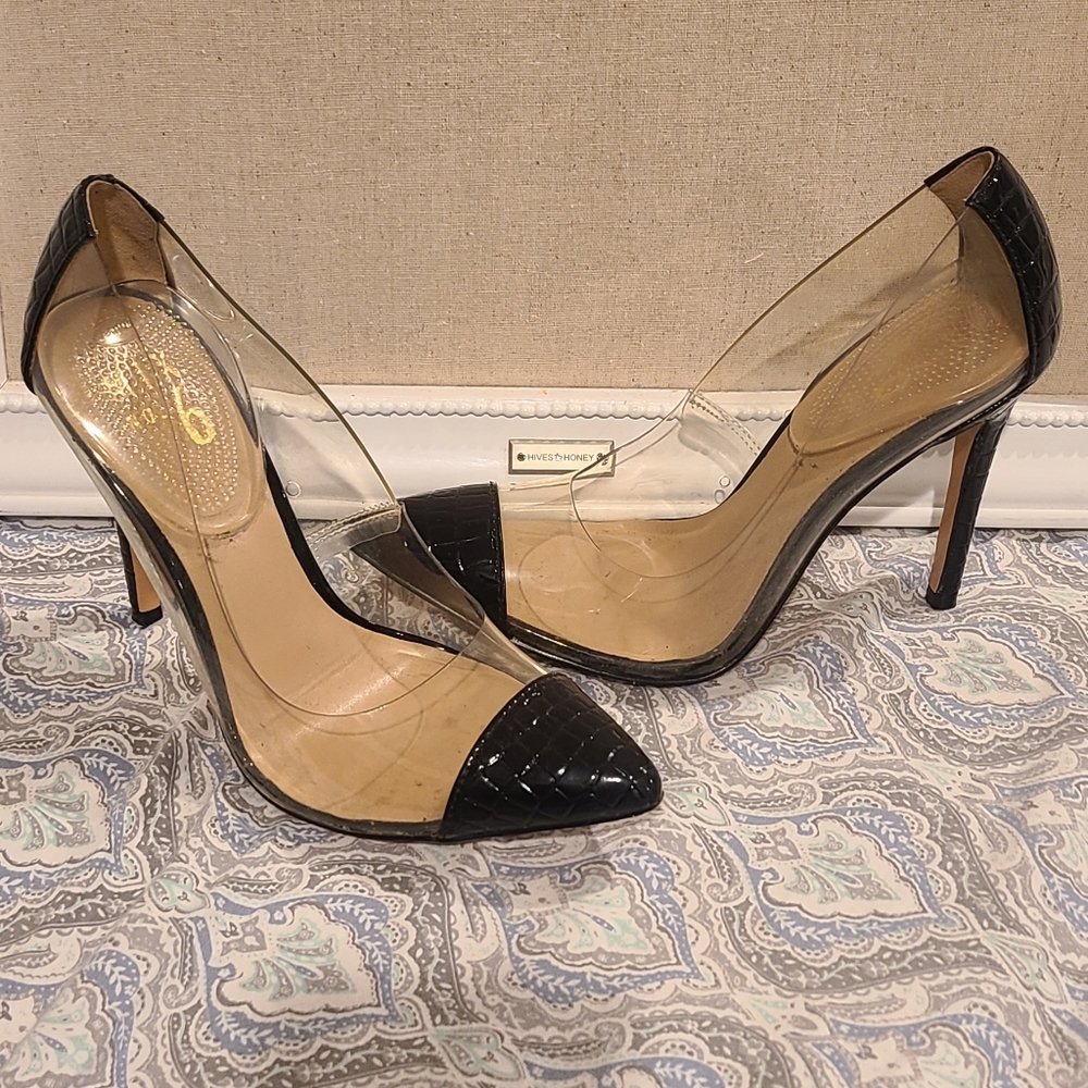 Clear with black pointed to heel